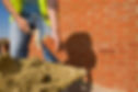 Man cementing bricks