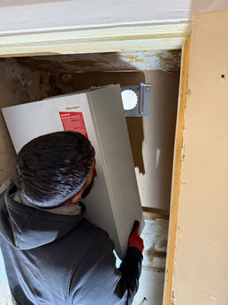 Engineer lifting a boiler