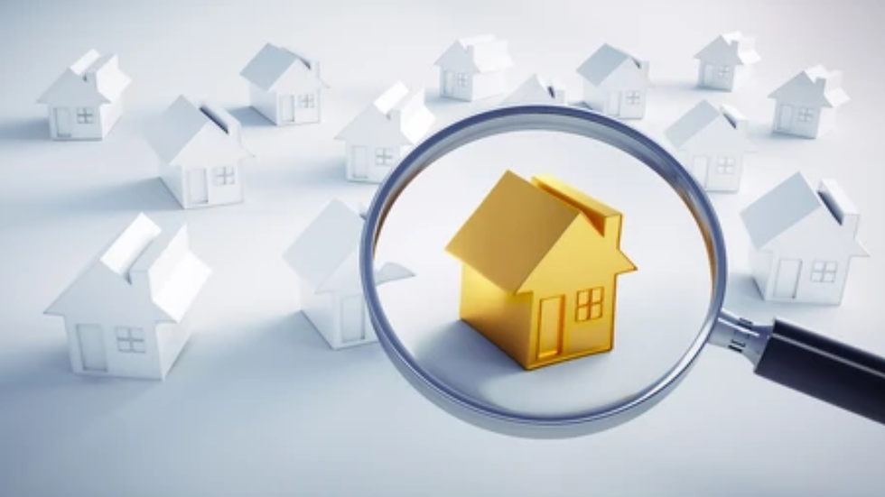 Magnifying glass focuses on a yellow house among white houses, emphasizing uniqueness. Blue-gray background. No text present.
