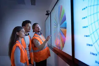 team-looks-at-data-visualization-on-large-screen-2026-01-09-09-26-18-utc copy.webp