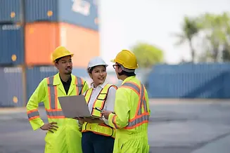 employees-in-safety-gear-discuss-work-at-cargo-por-2026-01-09-12-00-53-utc copy.webp
