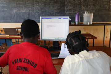 Students working independently on computers in the school's computer laboratory.
