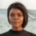 A Galfundi woman poses infront of the Indian Ocean