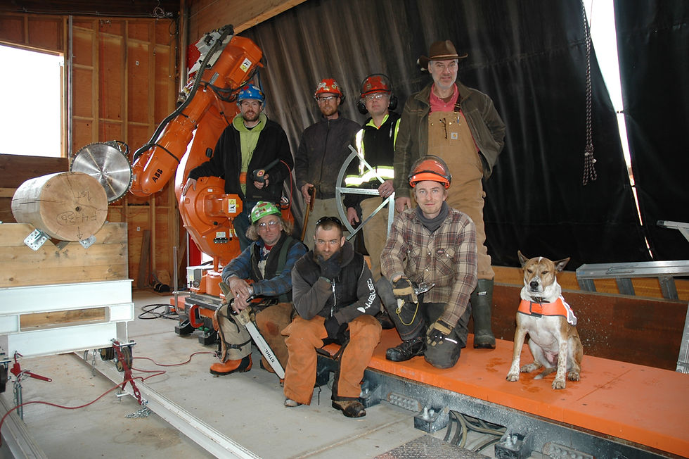 Nicola Logworks crew photo with ABBy the Robot for custom non-settling post and beam, advantage panel log homes