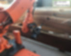 ABBy the robot cutting custom log stair support beam by Nicola Logworks, for Carolina Timberworks