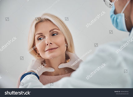 stock-photo-healthcare-professional-in-a-face-mask-and-sterile-gloves-palpating-the-female