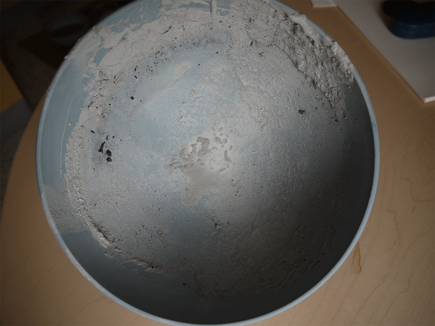 Pocelain bowl covered with raw clay