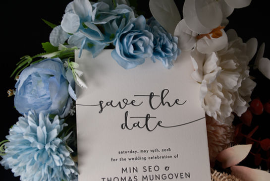 Elegant custom wedding invitation with letterpress and foil stamping in navy and gold