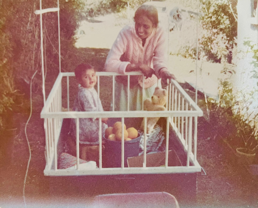 Sheila playing with Shali in the converted trailer playpen