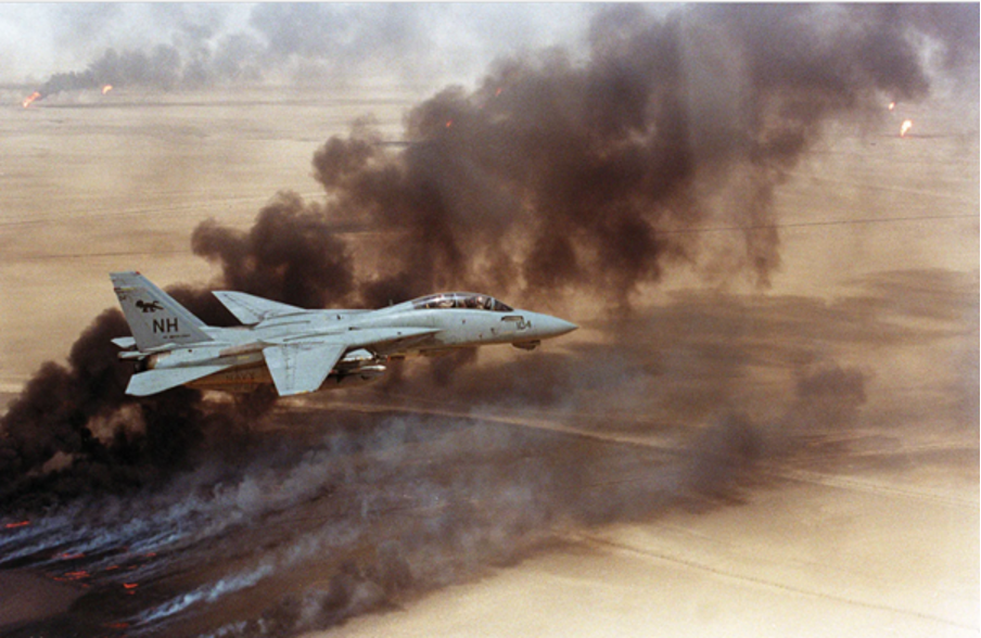 U.S. F14 flying over Kuwaiti oil wells set alight by Iraqi troops.