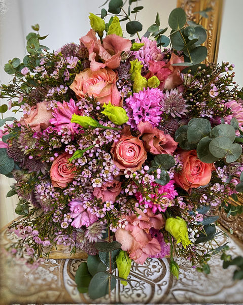 Beautiful bouquet from spring flowers, in the nuances of pink and purple.