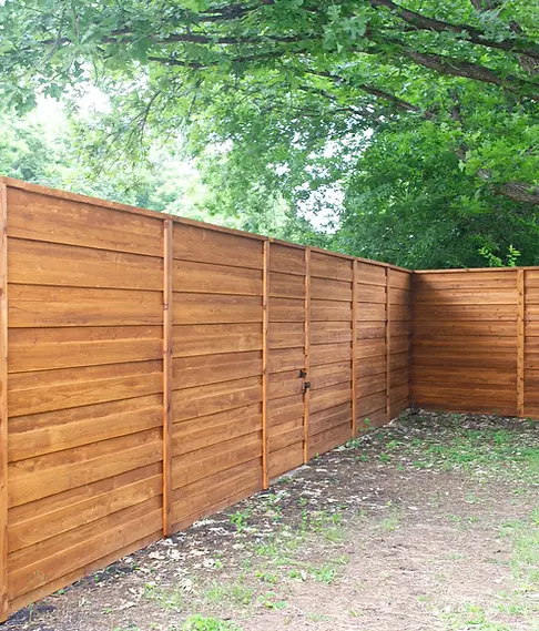 Horizontal cedar privacy fence installation Houston Texas modern backyard design