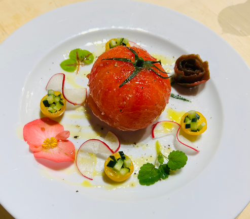 Tomato filled with fresh mozzarella, basil and seasoned olive oil