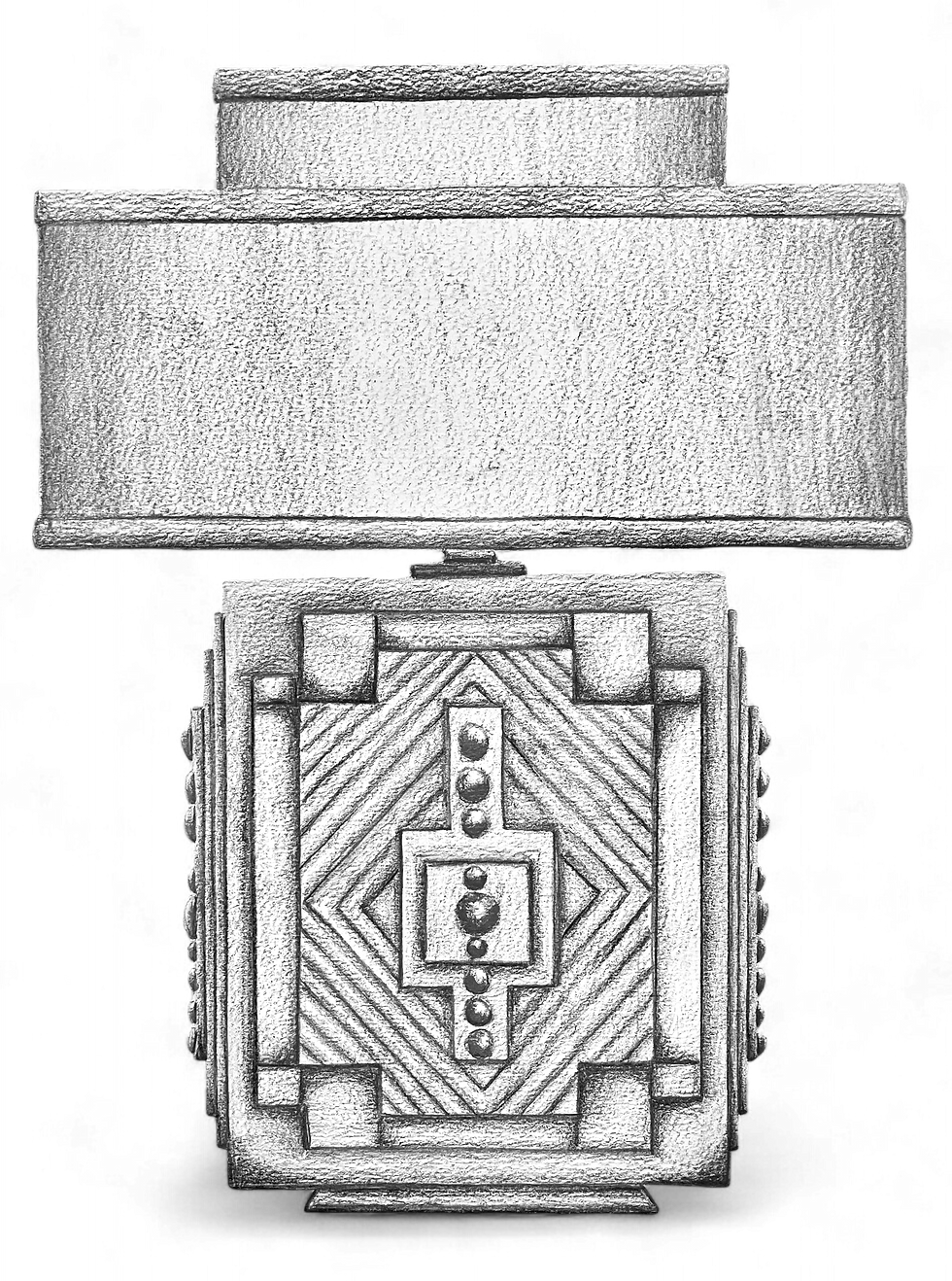 A stylish silver lamp featuring a geometric design, perfect for enhancing modern interior decor.
