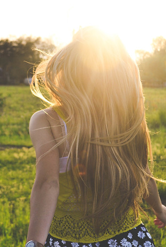 Girl Running in a Field