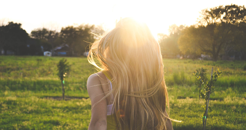 Girl Running in a Field