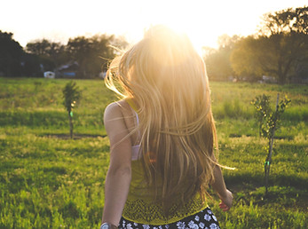 Girl Running in a Field