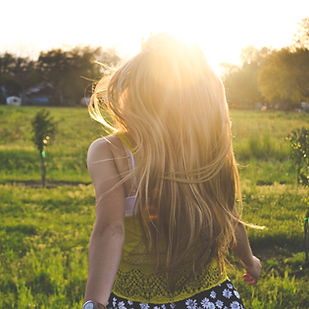 Girl Running in a Field