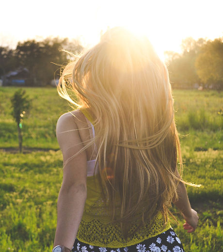 Girl Running in a Field