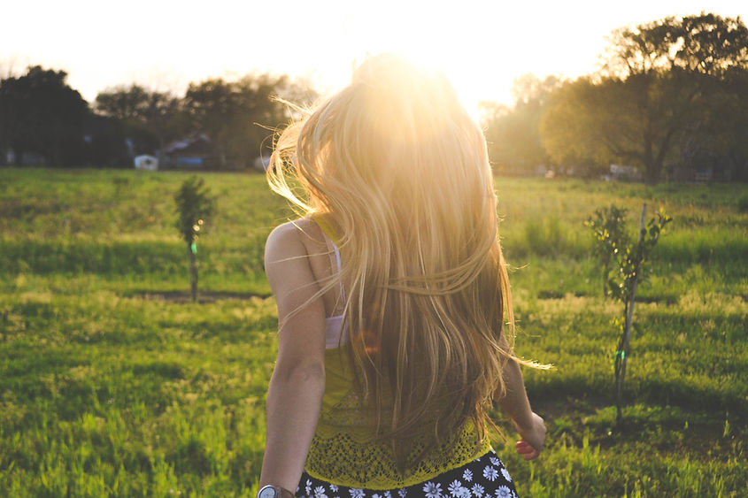 Girl Running in a Field