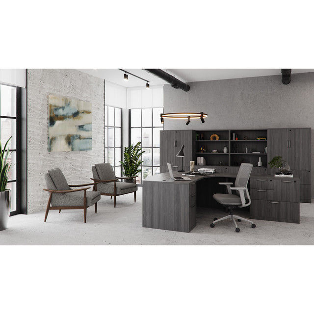 Thumbnail: Mira lounge chair in charcoal gray fabric with walnut wood frame in office