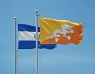 El Salvador and Bhutan flags side by side under a clear blue sky, El Salvador e-Tourist visa for Bhutan citizens.