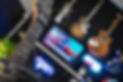 Schecter guitar with guitars blurred in the background