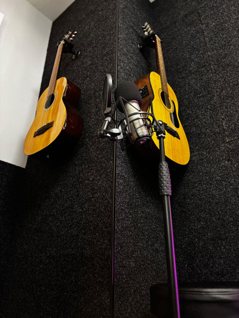 Acoustic guitars hanging on wall 