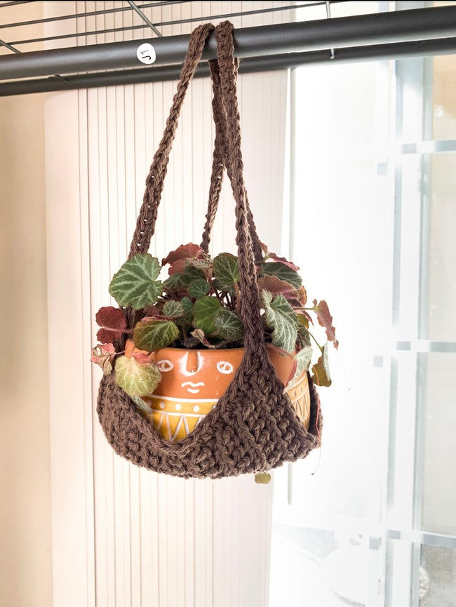 Crocheted plant hammock from durable yarn in a chocolate color. 