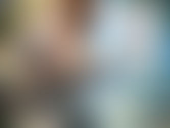 A girl looking at her own image reflected in the calm waters of a river