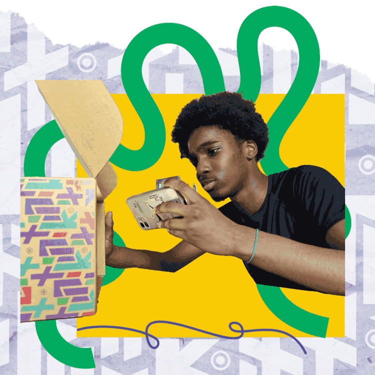 A young person examines a phone while leaning toward an open LitKit box with multicolored designs