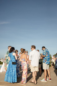 group of people standing together talking with sunny backround