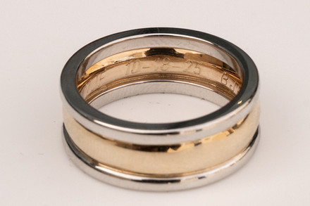 Close up of grooms ring with engraving