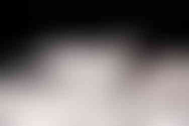 close up of Jewish wine glass with vow books 