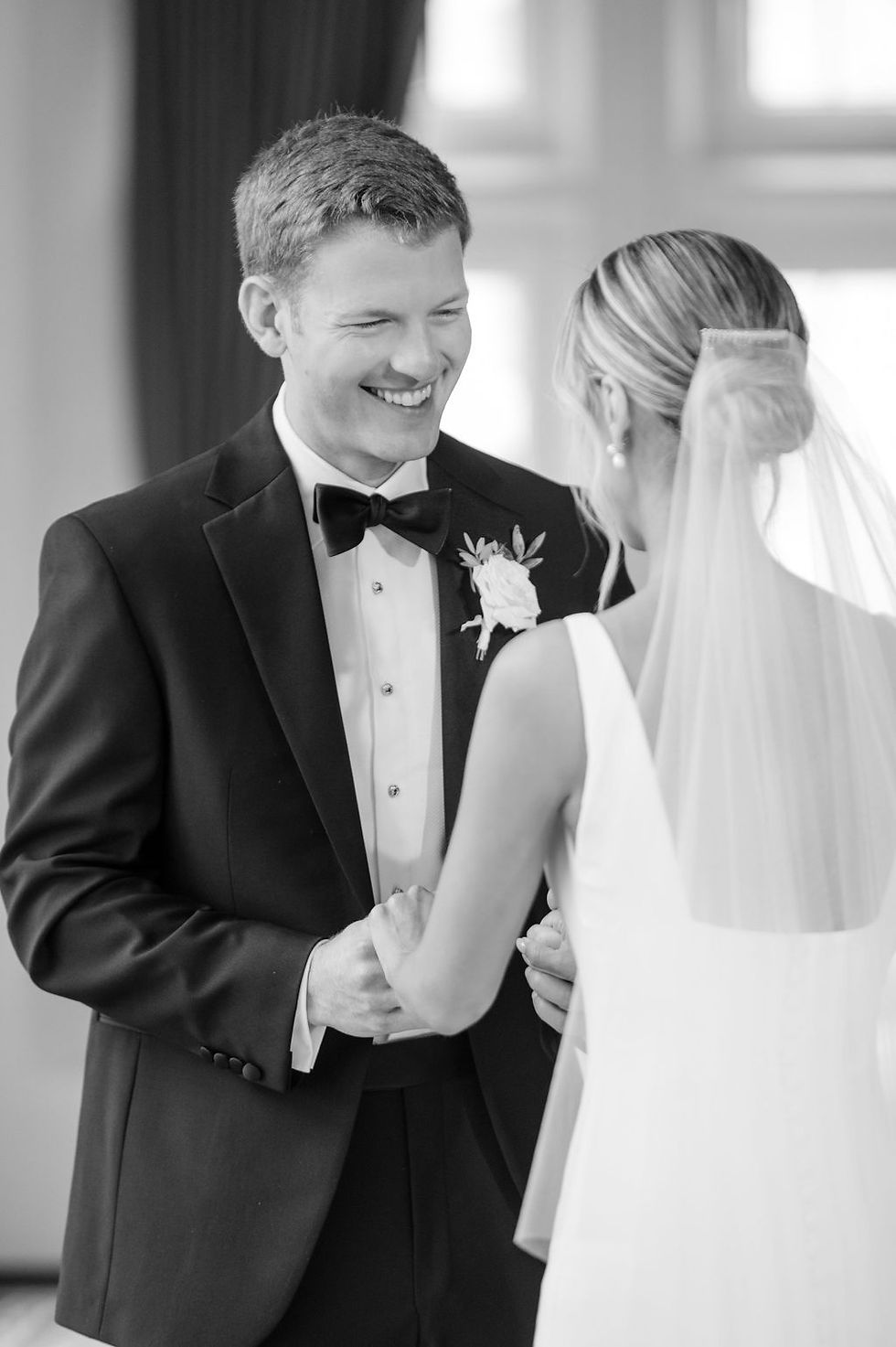 groom looking at bride smiling