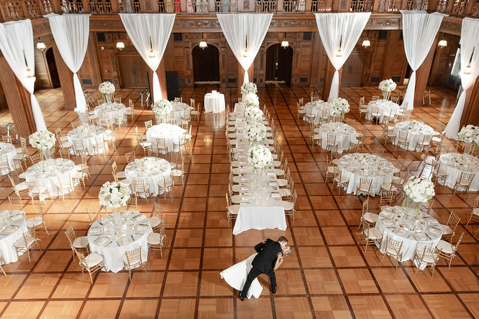 bride and groom doing first dance kissing
