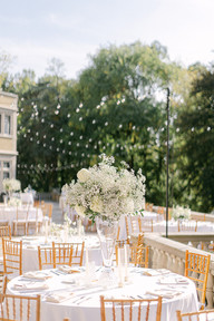 wedding reception table elevated floral in center of table