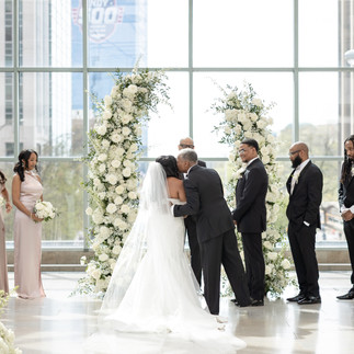 dad giving bride away at the end of the aisle kissing on the cheek