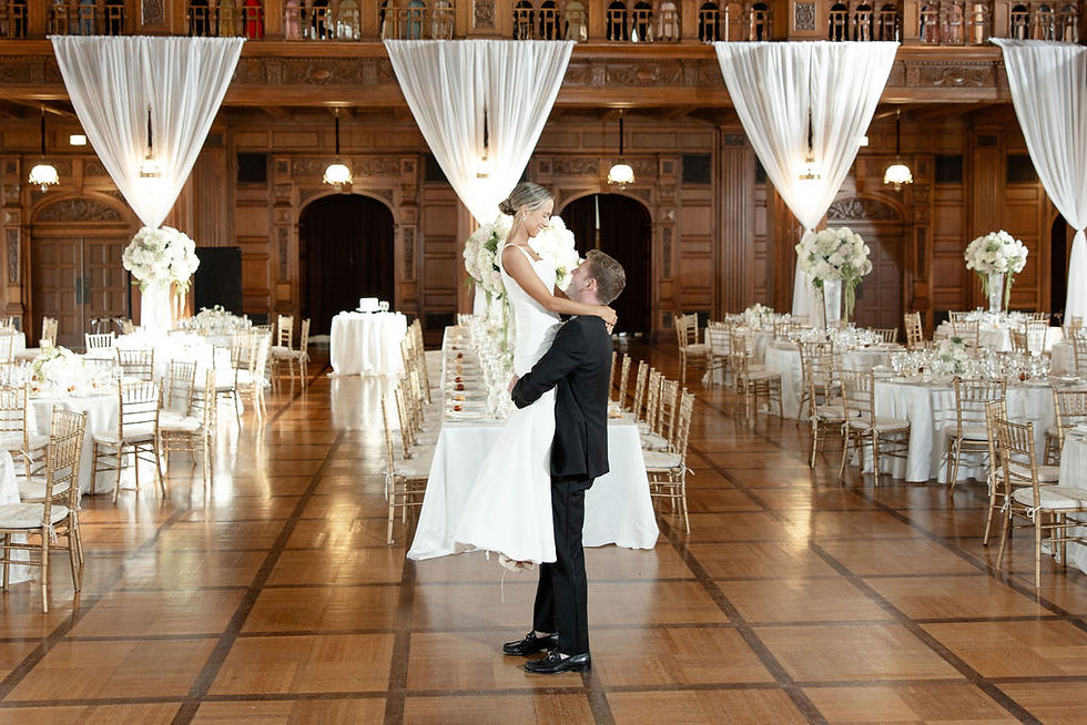 groom lifting bride during first dance