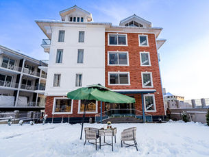 Exterior view of Best Family Hotel in Pahalgam offering safe stay and scenic surroundings
