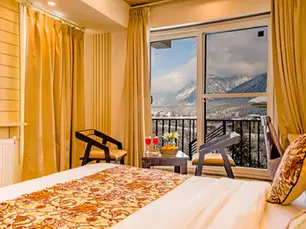 Spacious rooms at an Affordable Luxury Stay in Pahalgam featuring scenic mountain views