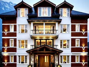 Luxury hotel room with breakfast and mountain view showcasing Pahalgam hotel prices at Still Season by Defoy