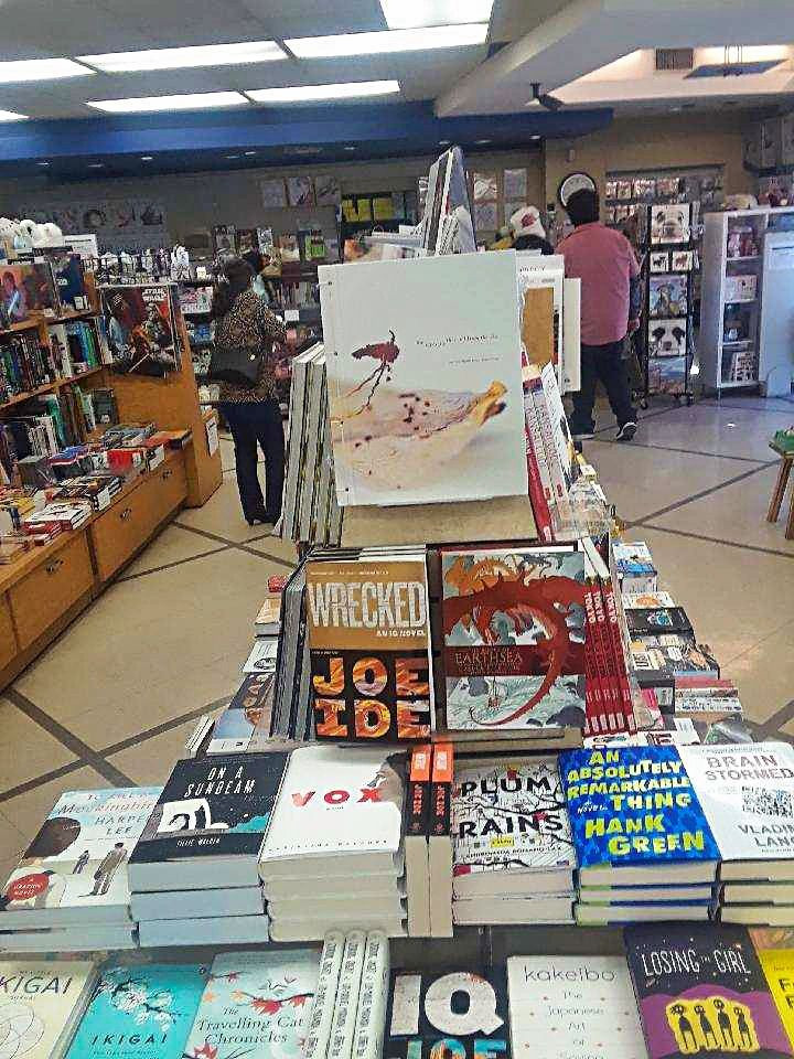 Judy Choi of Tigrefou Editions Las Vegas Writer with book and Kinokuniya Los Angeles Book Store Francis George Photographer Phoenix Brown Writer