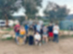 Group-of-young-adults-posing-on-farm