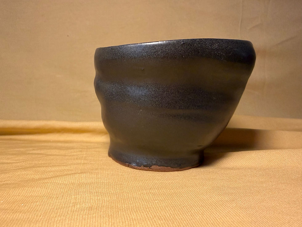 Thumbnail: matte black planter with hole at base