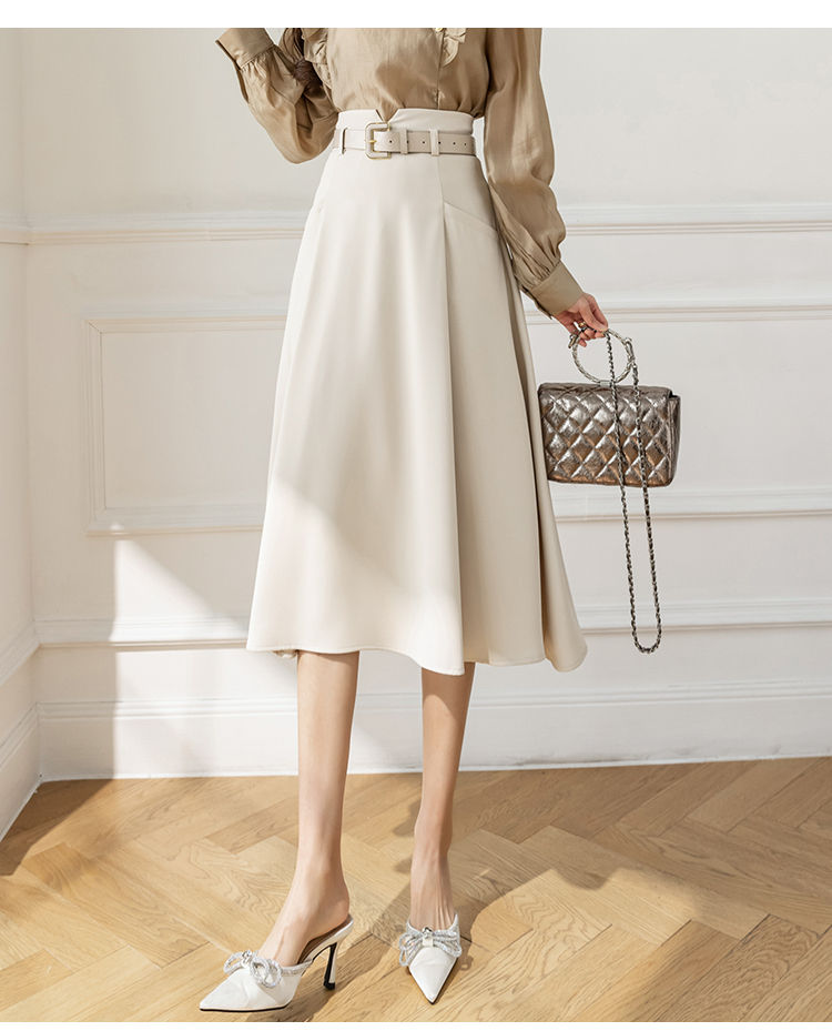 Thumbnail: Elegant light skirt, blouse, and heels