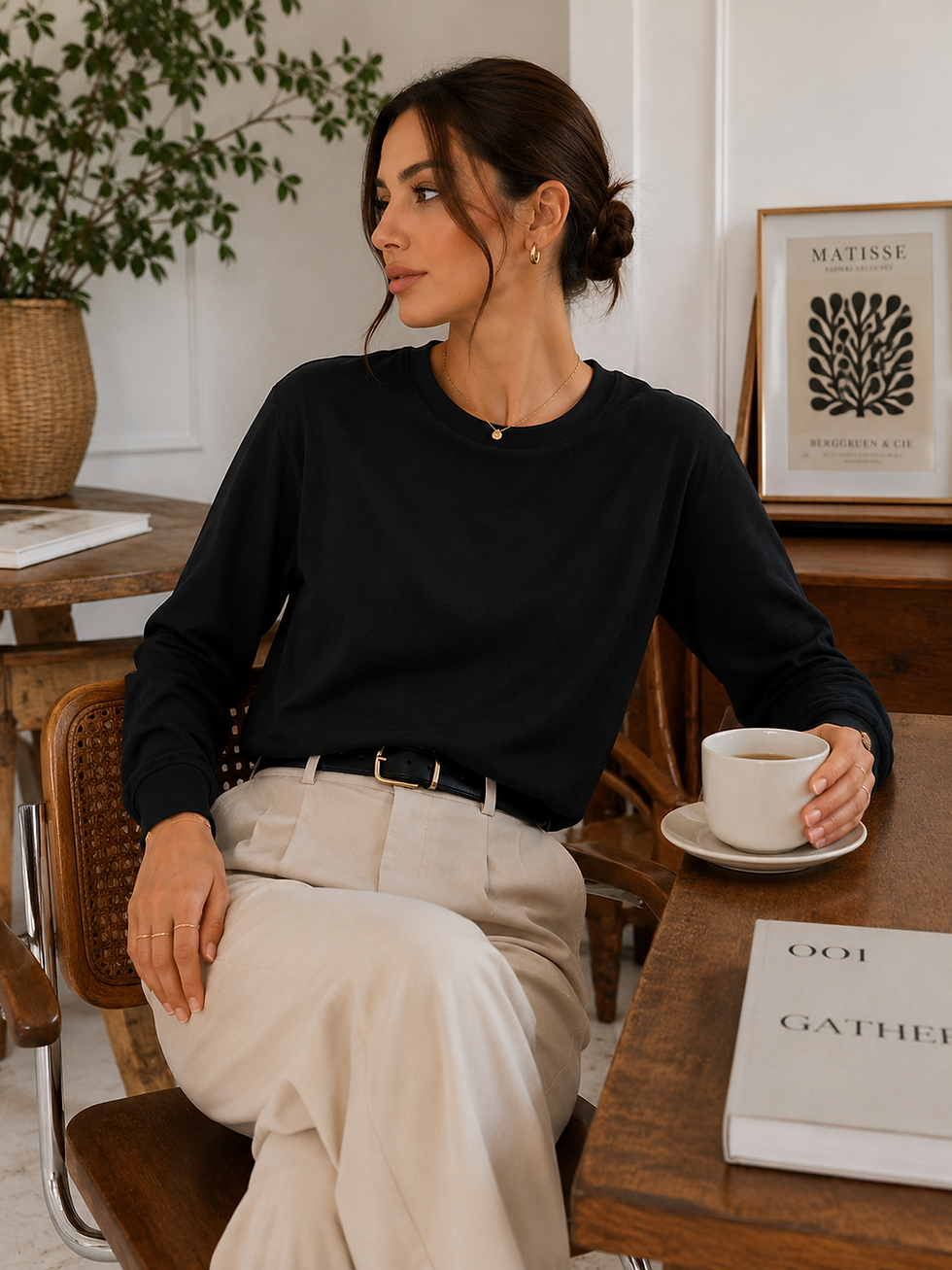 Thumbnail: Model in black long-sleeve top and light pants