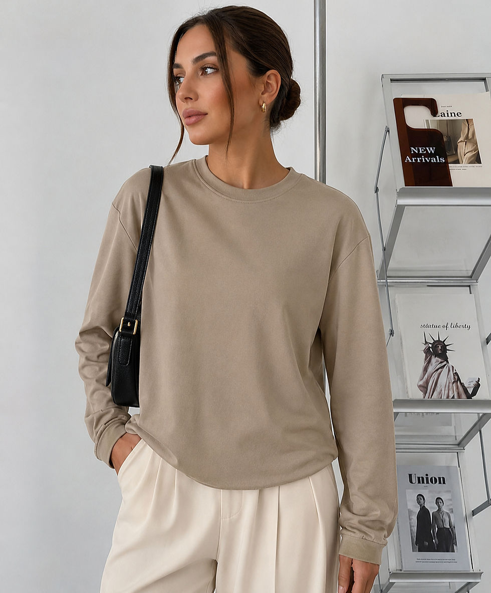 Thumbnail: Model wearing a beige long-sleeve top, light pants
