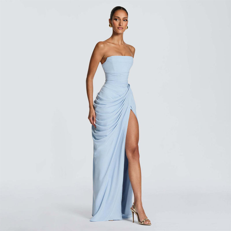 Thumbnail: Model in light blue strapless ruched party dress with high slit.