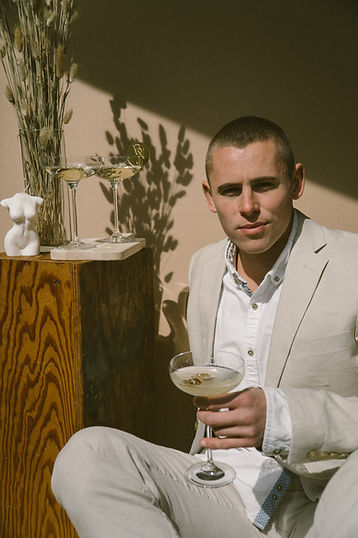 Model wearing tan suit